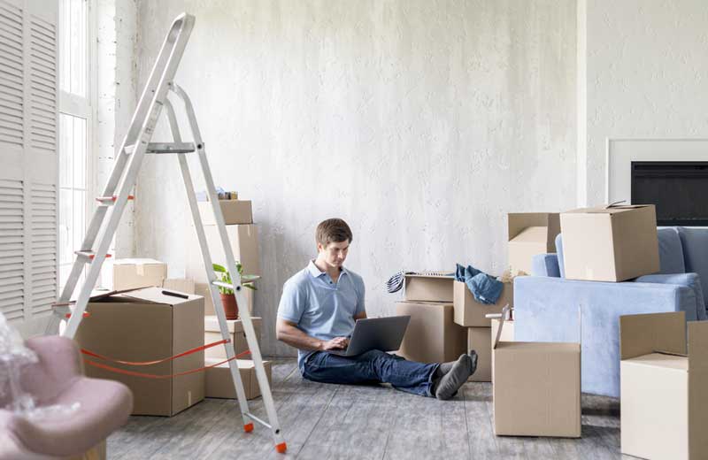 man home with boxes ladder getting ready move out